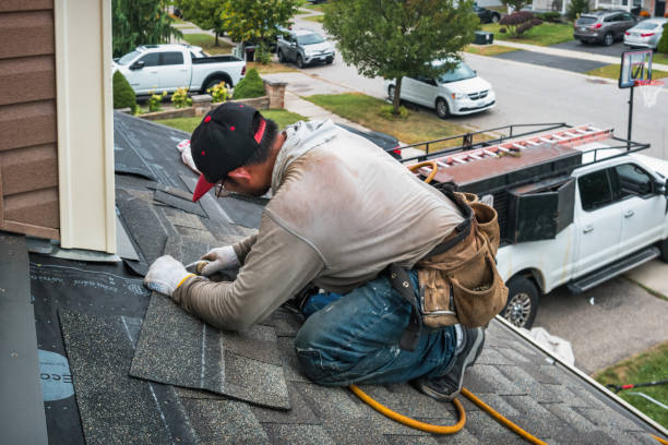 Professional Roofing technician working in Highland, MI